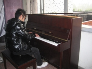 Rainbow Missions LQP playing piano